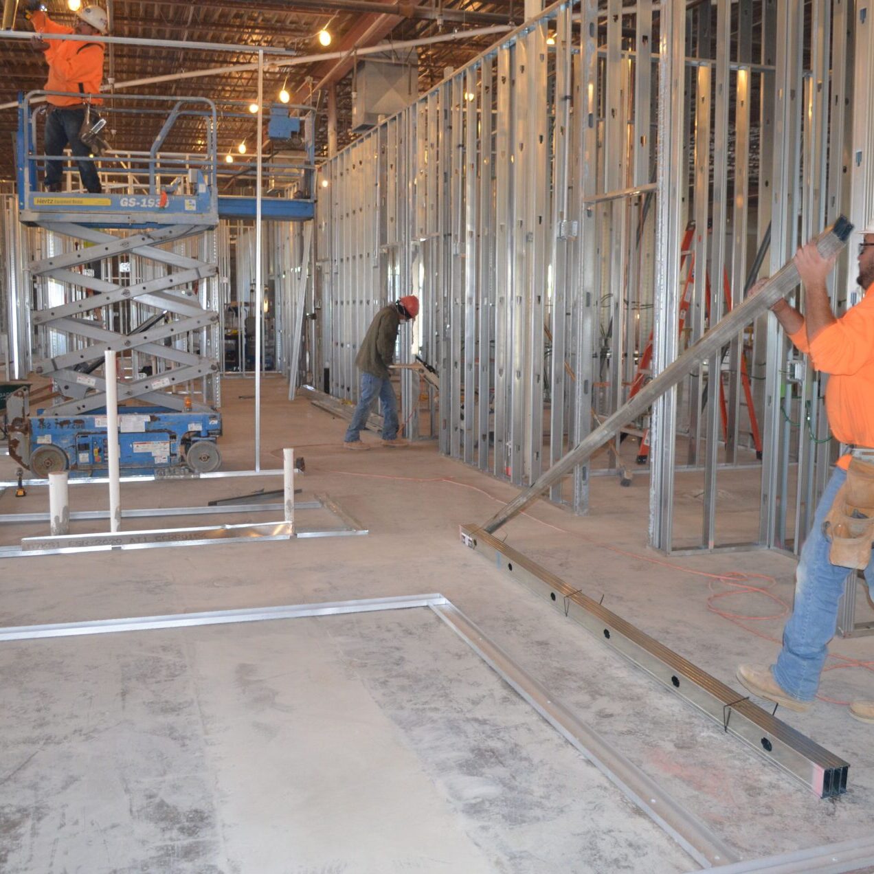 A group of men working on the inside of a building.